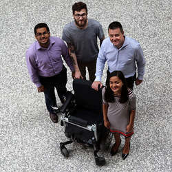 Members of the research team that developed a system to make electric wheelchairs partly or fully autonomous.