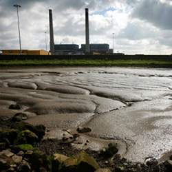 Tilbury power station overlooking Thames mudflats.