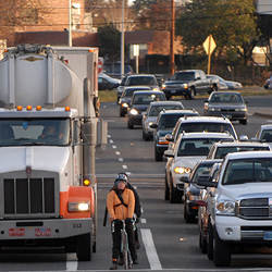 Biking in traffic.