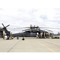 Airmen from the 920th Rescue Wing out of Patrick Air Force Base, Florida prepare a helicopter for final inspection before being deployed to Houston to assist in rescue efforts.