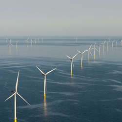 Offshore wind turbines generating electricity.