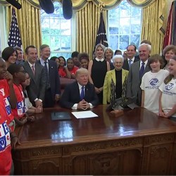 President Trump and guests in the Oval Office