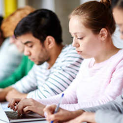 A young women in a computer science class.