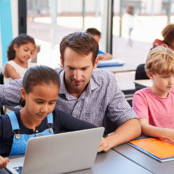 teacher and student at computer