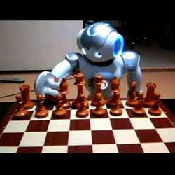 A robot plays chess