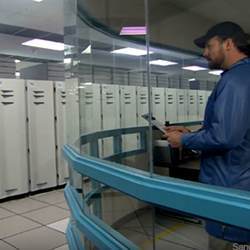 Overseeing maintenance on a supercomputer.