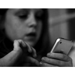 A child using a smartphone.