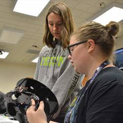  GenCyber Camp participants work to assemble, program, and test robots during part of the 2017 camp at SD Mines.