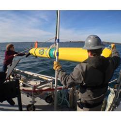 Researchers deploy an autonomous underwater vehicle.