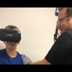 patient wearing VR headset and Chad Rudnick