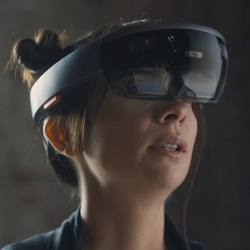 A young woman testing the HoloLens.