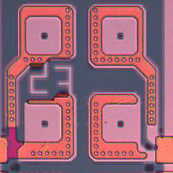 Section of a silicon wafer containing thousands of pores with contact pads for electrical characterization.