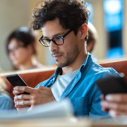 student with smartphone