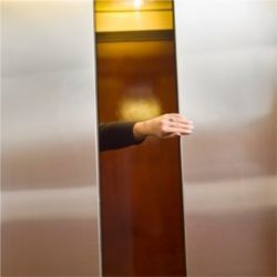 Holding closing elevator doors