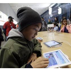 A young student learning to code.