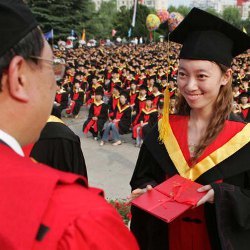 Chinese student receiving diploma.