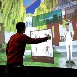 A student practicing tai chi with an avatar.