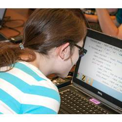 A visually impaired student learning to code.