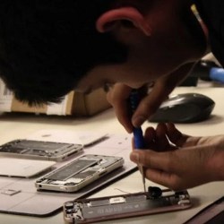 Surya Raghavendran repairing a phone