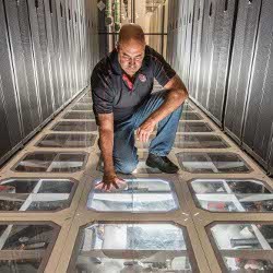 Sandia engineer David J. Martinez inspects cooling system