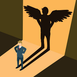 businessman with angel shadow