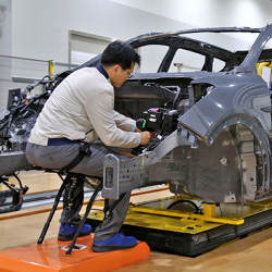 A worker wearing the Hyundai Chairless Exoskeleton assistive robot at Hyundai Motors research lab in Gyeonggi, South Korea.