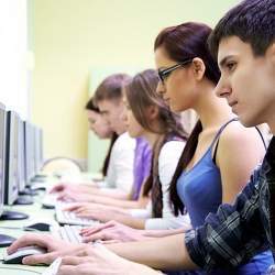 High school students using computers. 