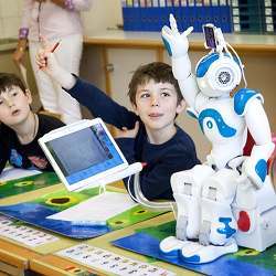 A robot in a class with human students. 