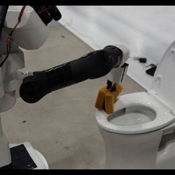 robotic system cleaning a toilet