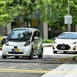 self-driving car and standard car on the street