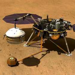 An artist's illustration of the InSight Mars lander using its robotic arm to cover a seismometer instrument with a wind and thermal shield.