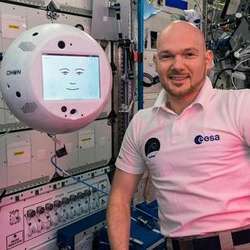 European Space Agency  astronaut Alexander Gerst of German poses with the robot CIMON on board the International Space Station.