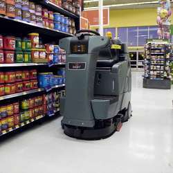 A robot scrubs floors at Walmart.