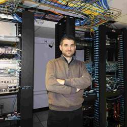 Flavio Esposito in Saint Louis University's datacenter.