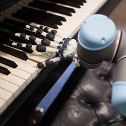 The robot is capable of performing simple songs in different styles.