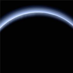 Pluto illuminated from behind by the sun