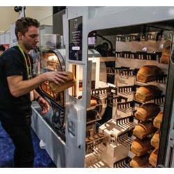 Removing a completed loaf from the BreadBot.