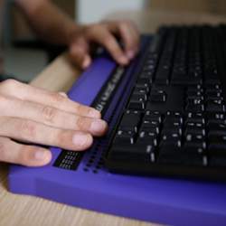 Typing on a Braille keyboard.