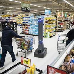 A robot cleaning floors in a grocery.