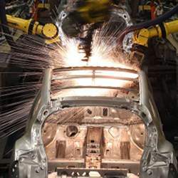Robot welders are part of the automotive manufacturing process. 