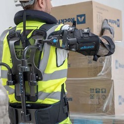 worker wearing EksoVest lifting a box