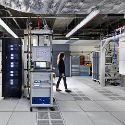 a quantum scientist walks across the IBM Q computation center in Yorktown Heights, NY.