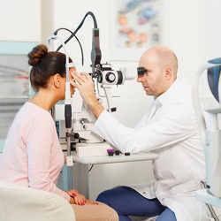 An eye doctor performing an exam.