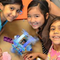 Girls working on a robot.