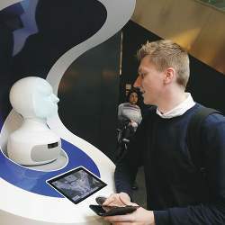 The robotic heads can communicate in German, English, and seven other languages.