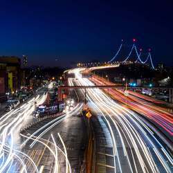 Vehicles make their way over the East River on the Robert F. Kennedy Bridge into Queens, NY.