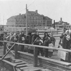 Immigrants arrive at Ellis Island in 1902.