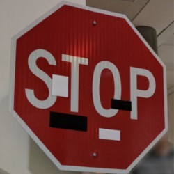 Stop sign with stickers