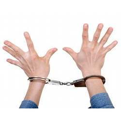 An individual in handcuffs.