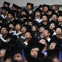 students at a graduation ceremony at Fudan University in Shanghai